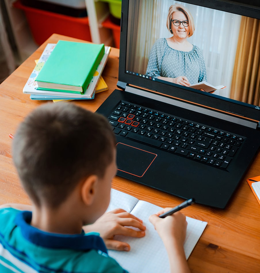 Young boy using laptop for his studies